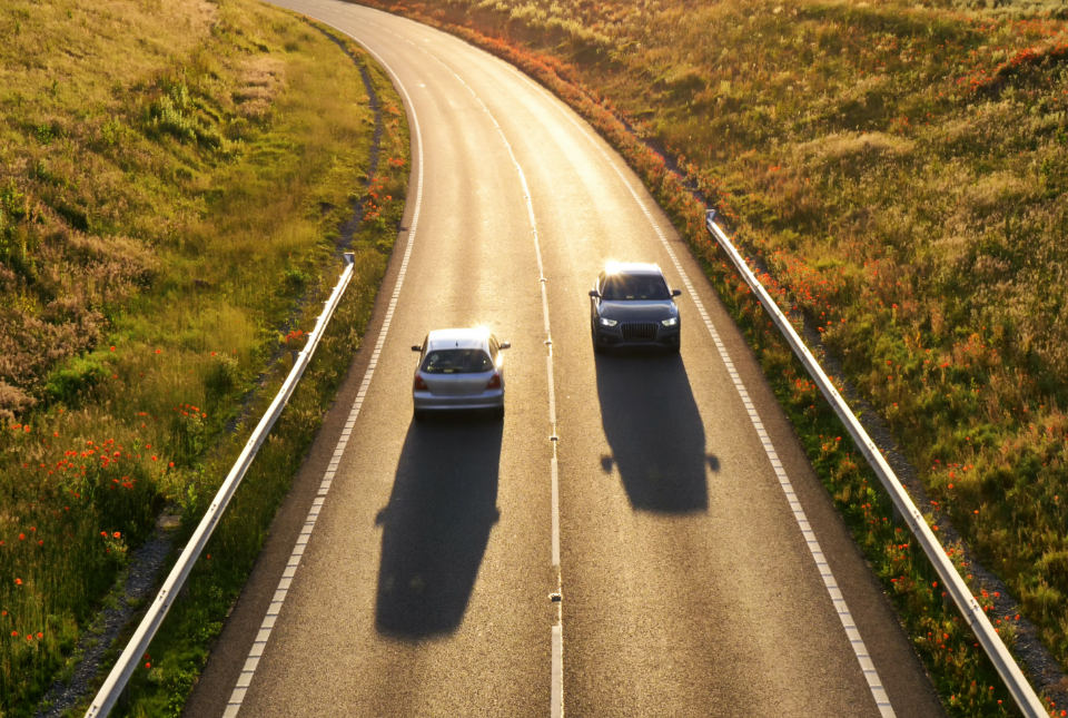 Two cars side by side in a row